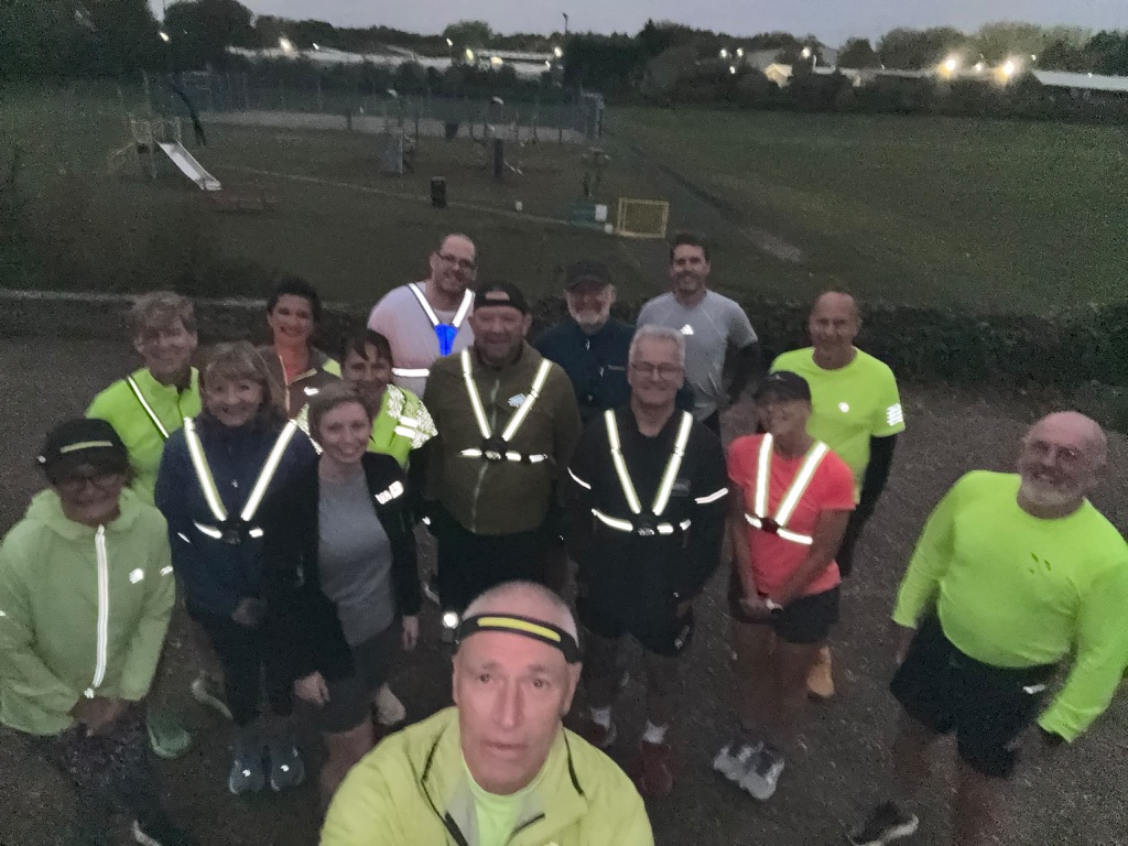 Norfolk Run Collective runners in hi-vis after a Monday evening session by the playground