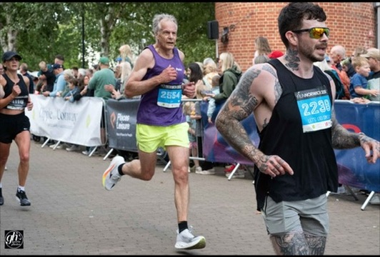 Two Norfolk Run Collective runners racing the Norwich 10k